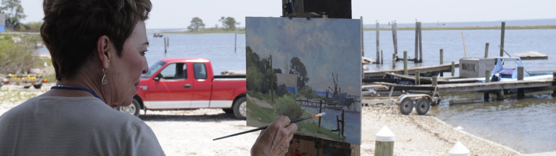 Woman painting the Bay in Eastpoint