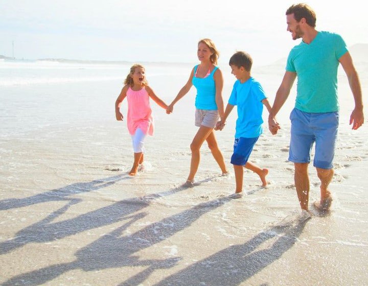 Family of Four enjoying their vacation on St. George Island Beach