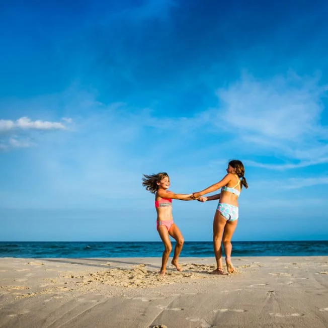 Two girls playing on St. George Island beach