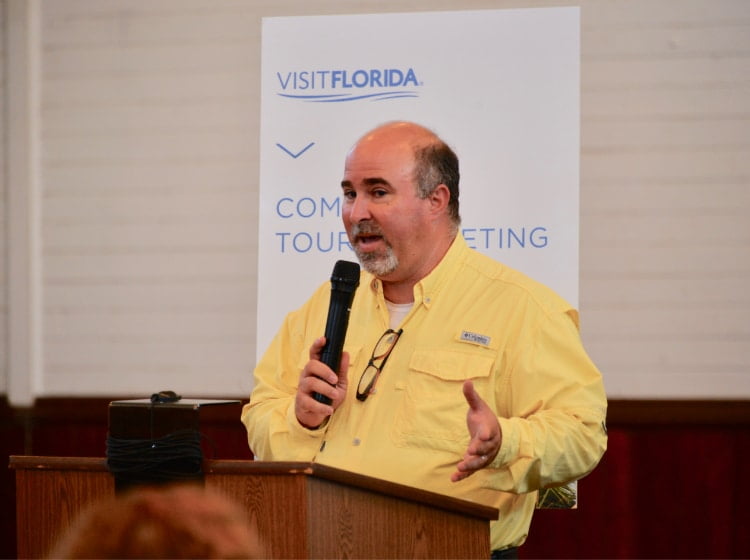 John Solomon speaking at a Visit Florida event in Apalachicola