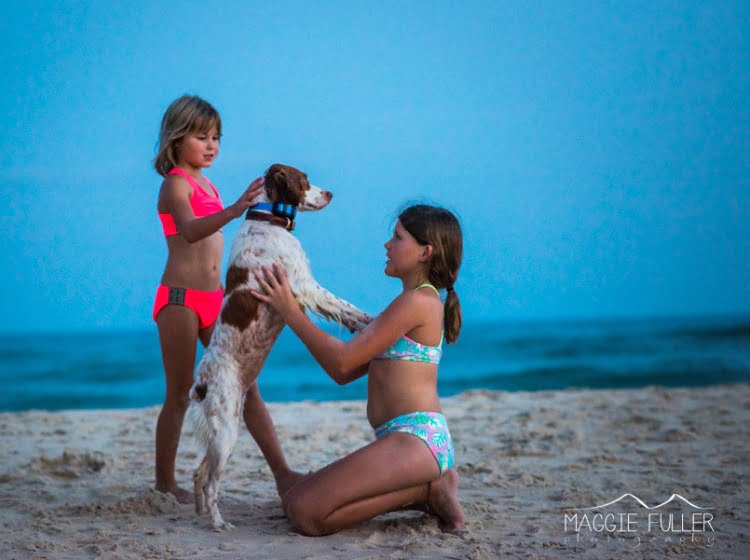 Kids on the beach with a pet