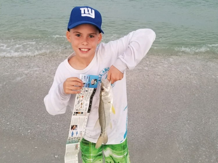 Boy holding a fish