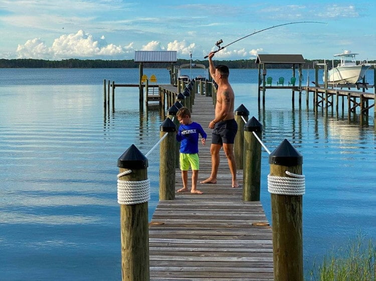 Son and Father fishing off a dock in Alligator Point