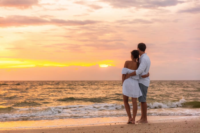 Couple walking on the beach St. George Island FL