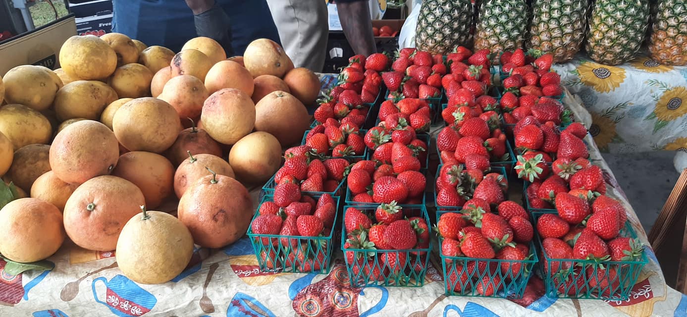 Photo of strawberries and squash at the Apalachicola Farmers Market